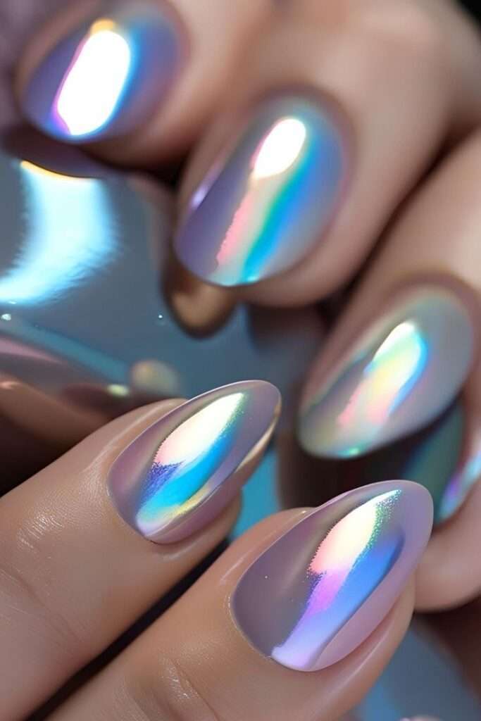 Chrome mirror nails in holographic finish, bold Y2K-inspired nail trend for concerts and parties in the US