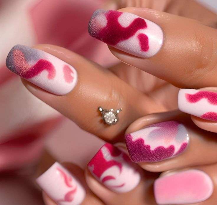 Cute pink and magenta heart nails with abstract design, perfect Valentine’s Day nail idea for US girls and teens
